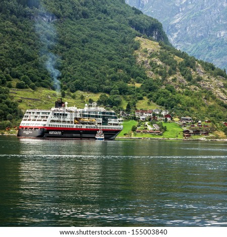 GEIRANGER, NORWAY: Cruise ship Hurtigruten came into Geiranger port, Norway. Geiranger fjord was included by UNESCO in the list of the world natural heritage.