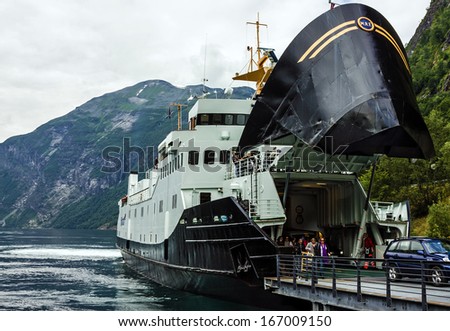 Ferry ship Fjord with open apparel in Geiranger sea port, Norway