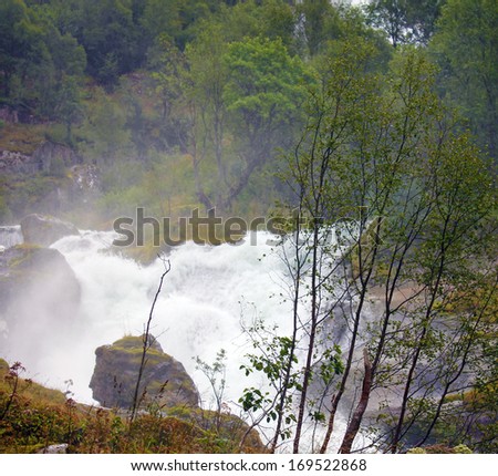 Spring water, stream mountain river, Briksdal, Norway. Norwegian landscape in national park Jostedalsbreen.