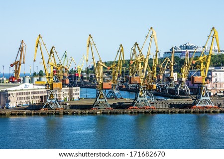 Port cranes in cargo front of Odessa sea commercial port - logistic center.
