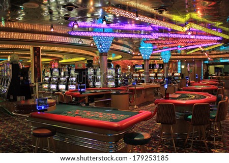Poker tables and gaming slot machines in American gambling casino