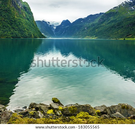 Norway mountain lake Oldenvatnet with the glacier Briksdal
