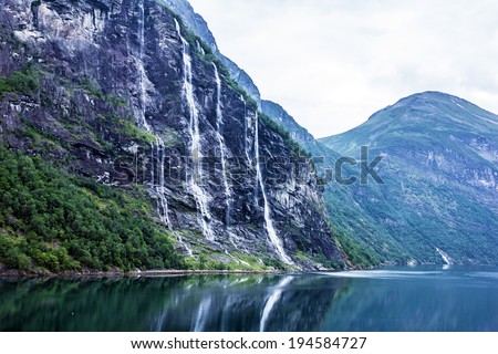 Geiranger fjord, Norway: landscape with mountains and waterfalls Seven Sisters.