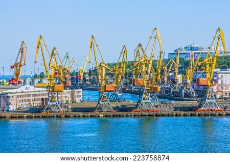 Port cranes in cargo front of Odessa sea commercial port - logistic center.