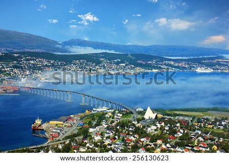 Bridge and panorama of city Tromso, Norway beyond the Arctic circle. View on mountains in Norwegian fjords