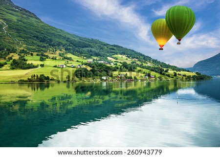 Country landscape, Olden, Norway. Hot air balloons