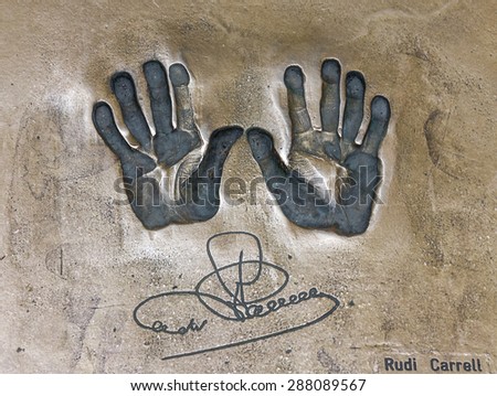 Print of hands and signature of Rudi Carrell. Both hands on cement mortar wall, Bremen, Germany