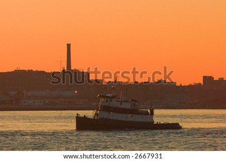 Tugboat on the East River at Dawn in New York City