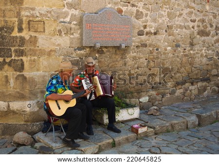 PLOVDIV, BULGARIA, AUGUST 3, 2014: Street musicians are playing on the street in historical core of plovdiv.