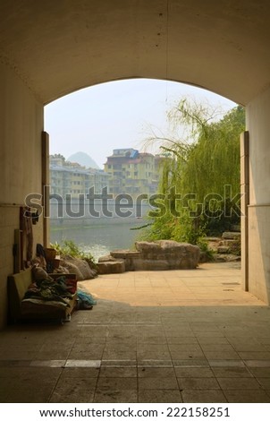 GUILIN, CHINA, OCTOBER 7, 2013: Homeless people use space under the bridge for sleeping in Guilin, china.