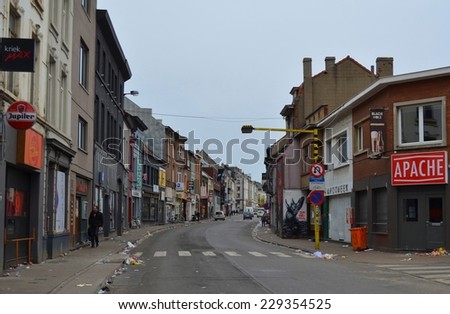 GENT, BELGIUM, JANUARY 25, 2014: Typical pub street in gent filled up with trash after party on friday night.