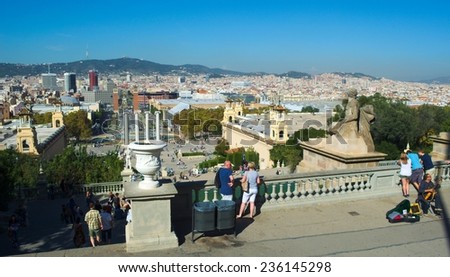 BARCELONA, SPAIN, OCTOBER 23, 2014: Paza espana in barcelona is a famous place for its magic fountain show, artificial waterfall, national museum and dozens of tourist admiring all of them.