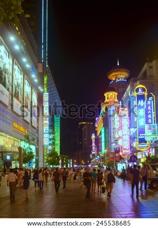 SHANGHAI, CHINA, SEPTEMBER 1, 2013: people are walking through nanjing road in shanghai, which is the main shopping boulevard in the city.