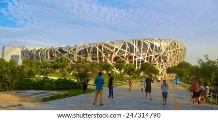 BEIJING, CHINA, AUGUST 20, 2013: people are walking in front of the birds nest olympic stadium in beijing.
