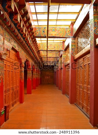 SHANGRILA, CHINA, NOVEMBER 20, 2013: red corridor of ganden sumtseling monastery known as little potala which is famous buddhist temple in yunnan, china.