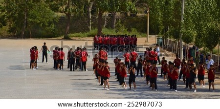 LUOYANG, CHINA, AUGUST 27, 2013: young chinese students of kungfu are training within the grounds of dengfeng shaoiln temple near luoyang