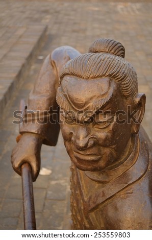 PINGYAO, CHINA, AUGUST 22, 2013: detail of statue of chinese warrior in chinese city pingyao.