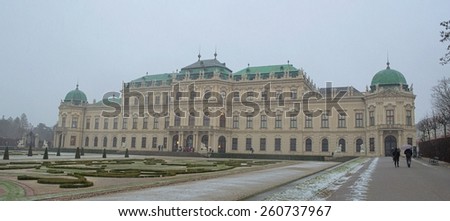 WIEN, AUSTRIA, JANUARY 4, 2015: vast belvedere palace complex is covered by snow during snow storm in january. nevertheless it is still visited by many tourists.