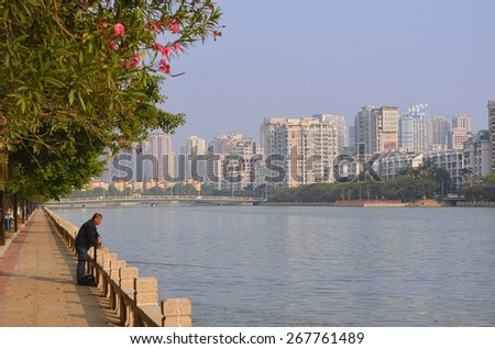 XIAMEN, CHINA, DECEMBER 5, 2013: view of the skyline of xiamen city next to the marco polo area next to the central lake.