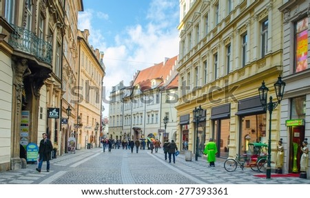PRAGUE, CZECH REPUBLIC, JANUARY 30, 2015: people are coming to the old town square (staromestske namesti) in prague through alley leading from the powder tower.