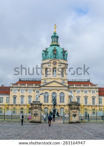 BERLIN, GERMANY, MARCH 12, 2015: people are passing by in front of the marvelous charlottenburg palace in berlin.