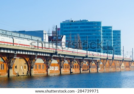 BERLIN, GERMANY, MARCH 12, 2015: train is coming to the jannowitzbrucke train station in berlin situated next to the jannowitz bridge and spree river.