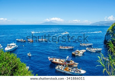 CAPRI, ITALY, MAY 15, 2014: people are waiting on various boats in order to get into the famous grotta azzura situated on capri island in the bay of naples.