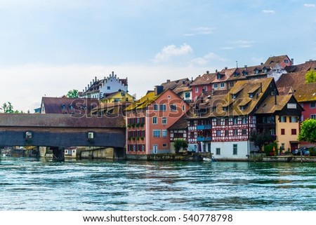 View of Diessenhofen town in Switzerland which is connected to germany by a covered wooden bridge over river Rhein