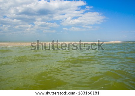 Recreation on the sandy shore of the Sea of Azov