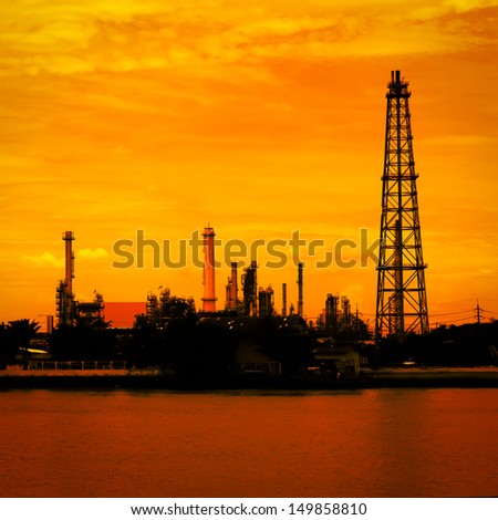 Petroleum oil refinery factory near riverside in Thailand, warm tone