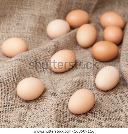 Eggs lay on sackcloth, selected focus