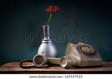 vintage old telephone, black retro phone is on the wooden table