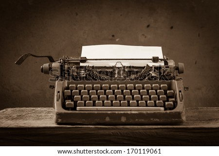 Old English type writer with paper sheet , still life