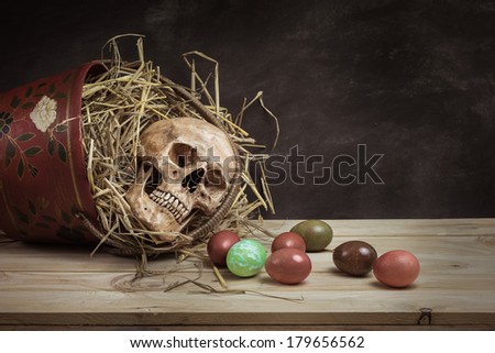 Still life with human head, colorful Easter eggs in nest from top side view