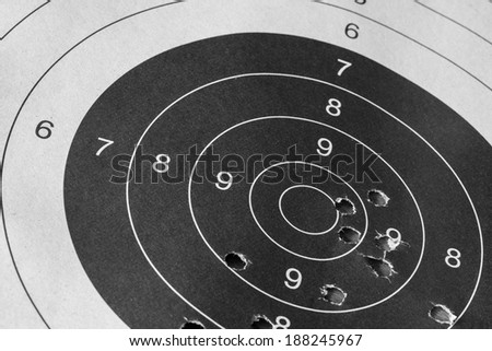 Bull eye target with bullet hole