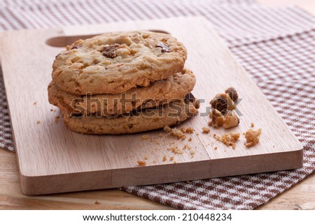 Stack of soft cookies on wooden plate