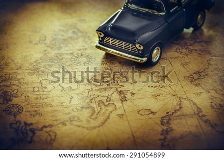 An old truck toy on a Treasure map background