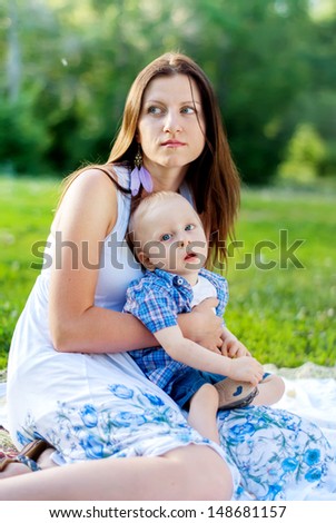 Young Mother with her son, Child has Cerebral palsy