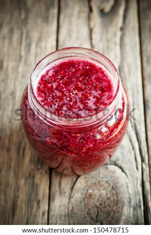 Fresh Raspberry Jam in an open Jar, selective focus