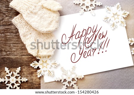 Christmas Card With Message Happy New Year On The Letter Isolated On White, Decorated Snowflakes And Mittens