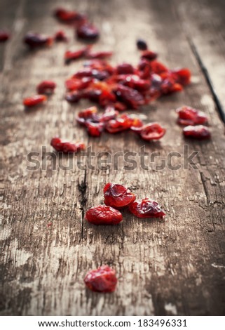 Dried Cranberries on wooden background. Healthy food organic nutrition
