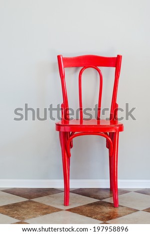 Red Chair on Tiled Floor and Near Grey Wall, indoor