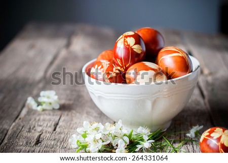 Easter Eggs Decorated with Natural Grass and Flowers and Boiled in Onions Peels, Rural Style