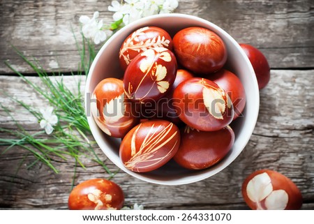 Easter Eggs Decorated with Natural Fresh Leaves and Boiled in Onions Peels, top view