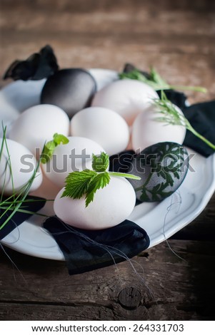 Eggs in Stage of Preparation of Decor for Happy Easter. Bio and Natural way of painted with Fresh Rasspberry Leaves and Boiled in Onions Peels