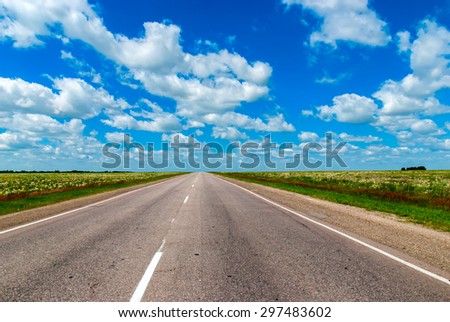 The Road Lies in a Field and Leaves to the Horizon. The Route in Russia