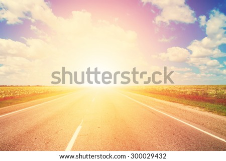 The Road Lies in a Field and Leaves to the Horizon, to Sunset. The Route in Russia