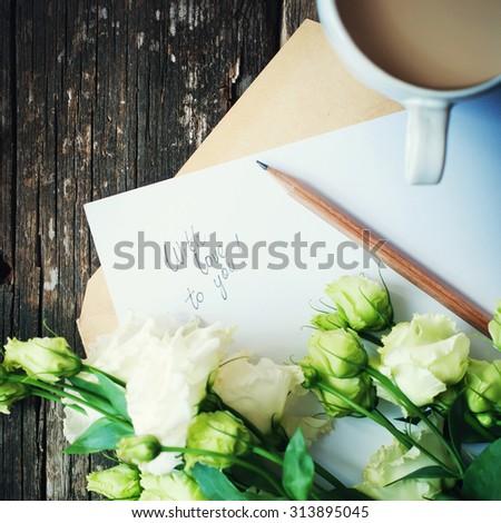 Message on Letter with Love You, Cup, Pencil, Light Green Roses to Valentine's Day on Wooden Table. Vintage Style