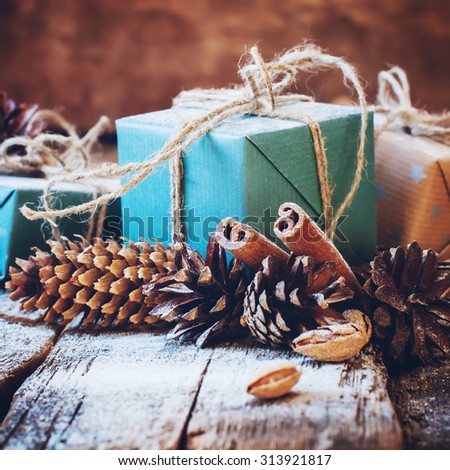 Holiday Boxes with Linen Cord, Cinnamon, Pine cones. Toned image