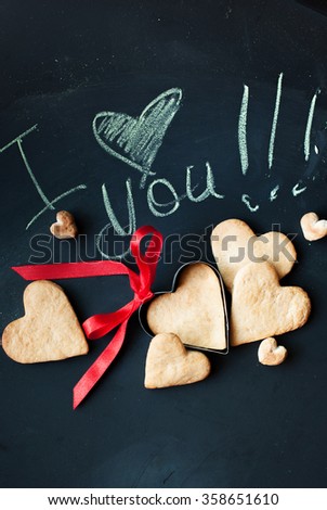 Message I Love You and Cookies in Shape of Hearts for Valentine\'s Day. Valentines concept on Dark Background